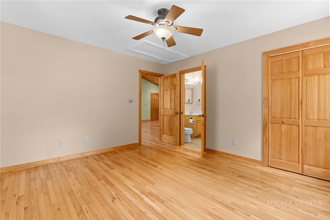 148 Woodby Ridge Road Vilas, NC 28692 - Photo 23 of 33 a view of empty room with wooden floor and fan