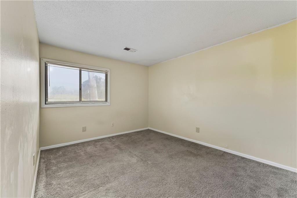 4755 Yates Road, Unit 6D College Park, GA 30337 - Photo 11 of 15 an empty room with windows