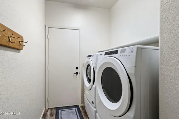 a utility room with dryer and washer