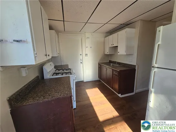 a kitchen that has a stove and a microwave