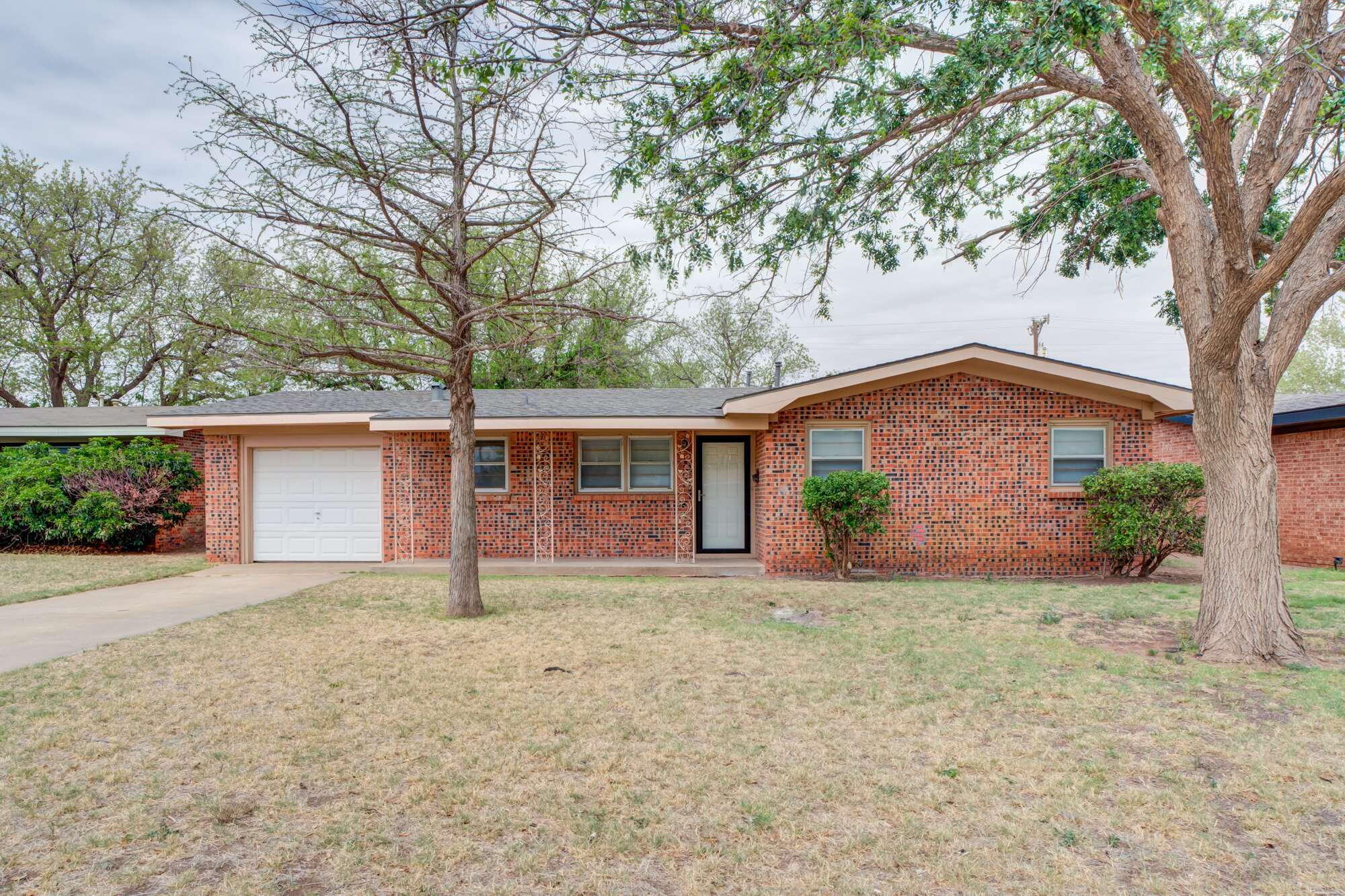 front view of a house with a yard