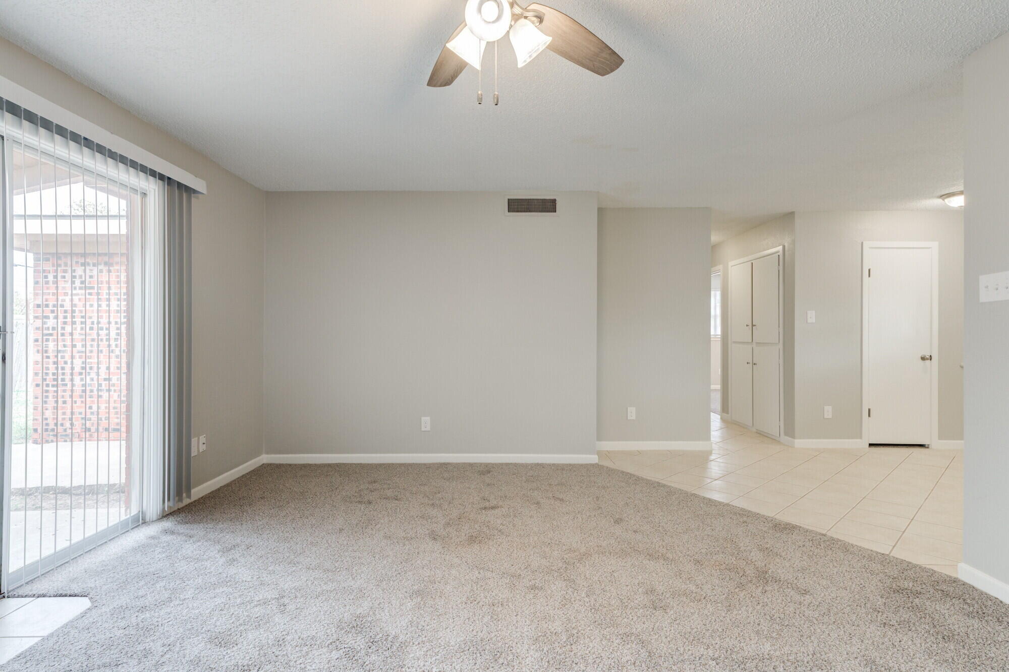4916 46th Street Lubbock, TX 79414 - Photo 13 of 31 wooden floor in an empty room with a window