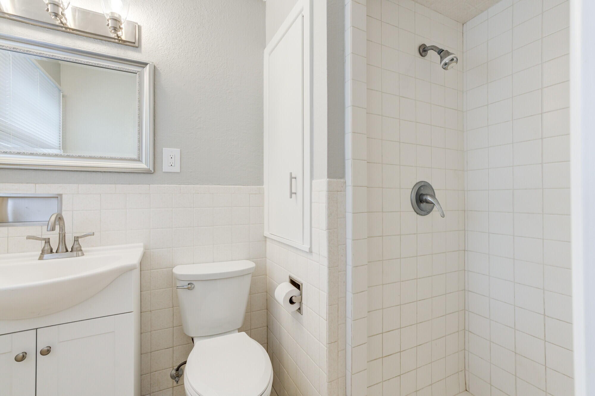 4916 46th Street Lubbock, TX 79414 - Photo 20 of 31 a bathroom with a toilet sink and shower