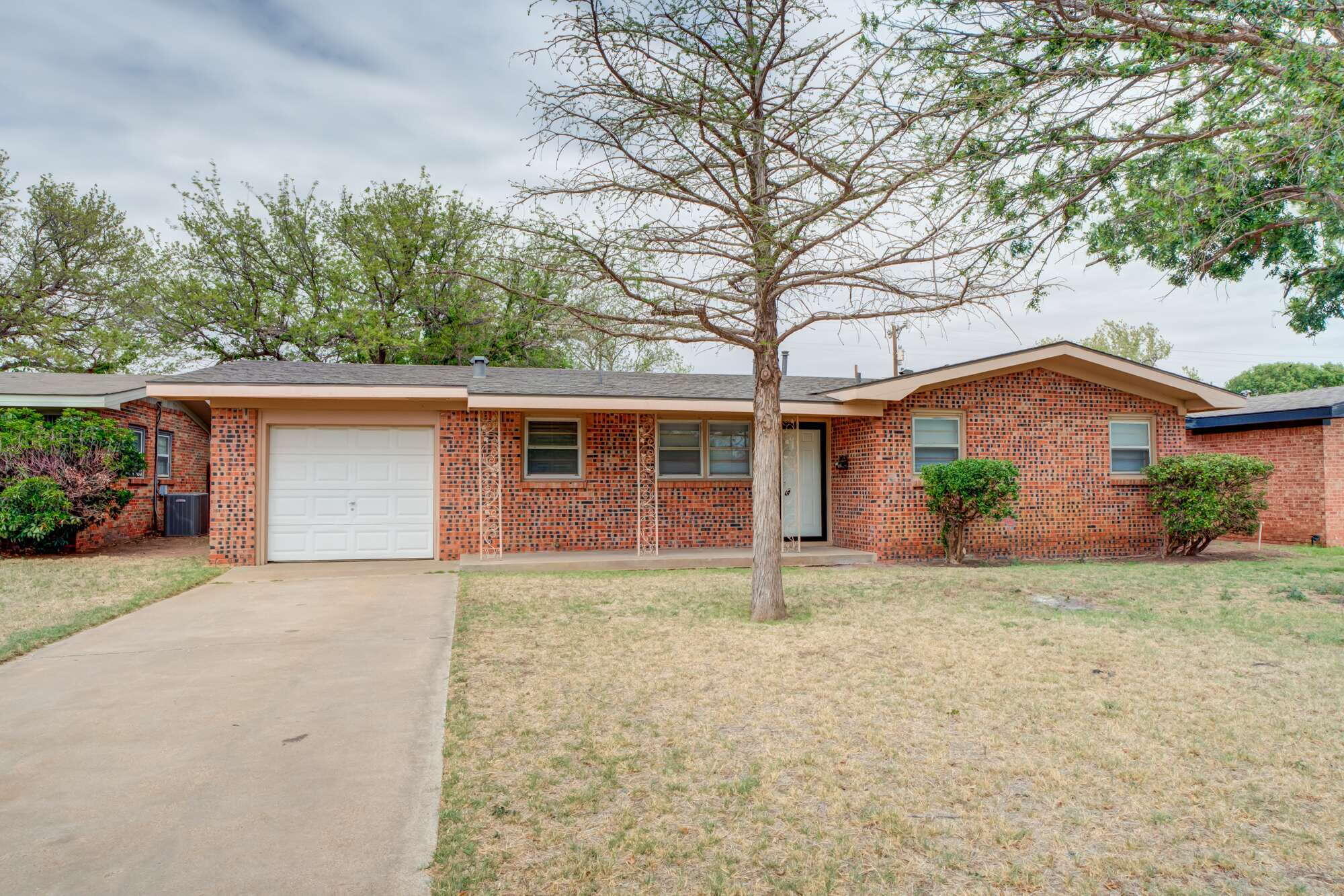 4916 46th Street Lubbock, TX 79414 - Photo 2 of 31 front view of a house with a yard