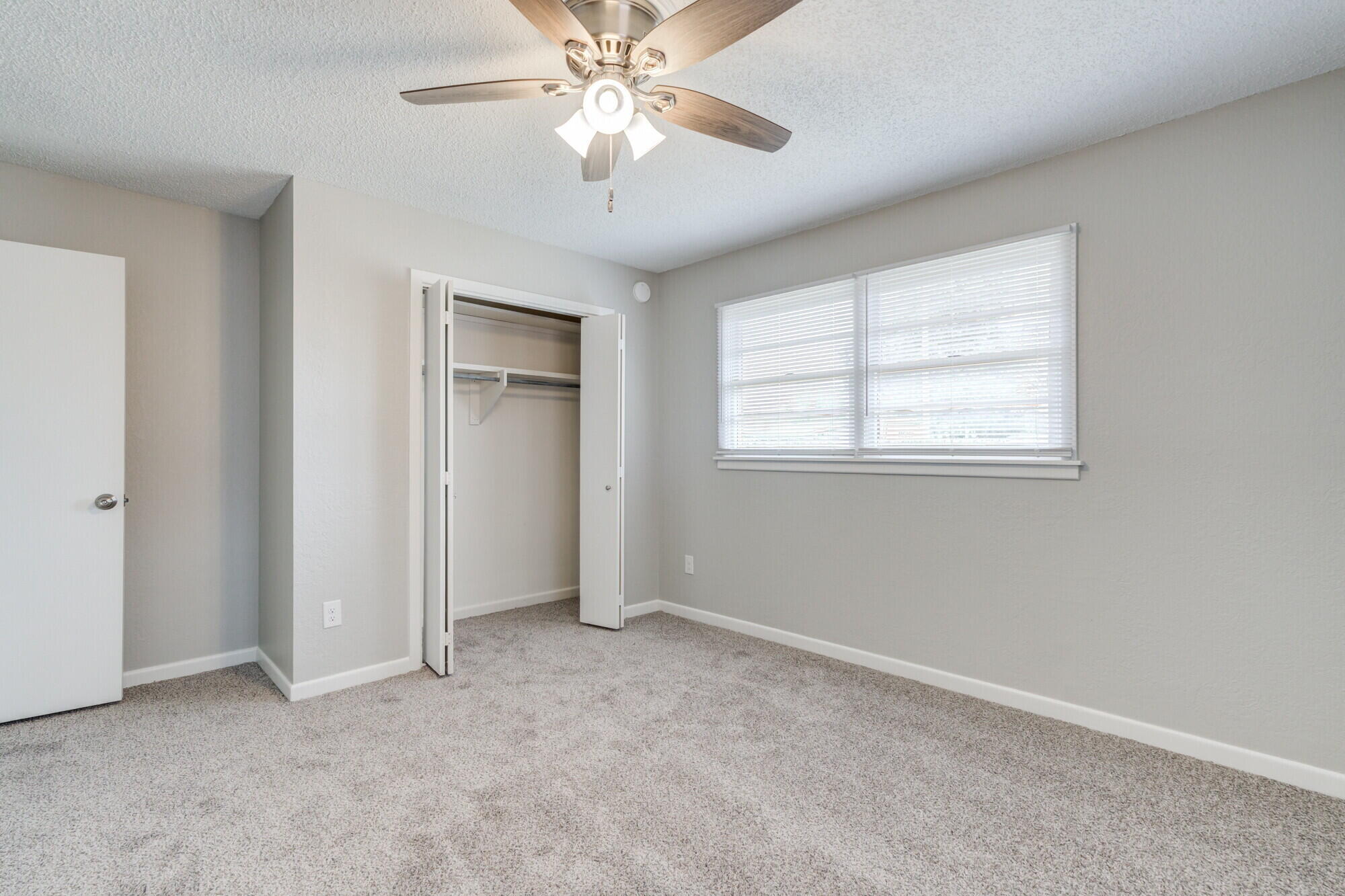 4916 46th Street Lubbock, TX 79414 - Photo 24 of 31 an empty room with windows and fan
