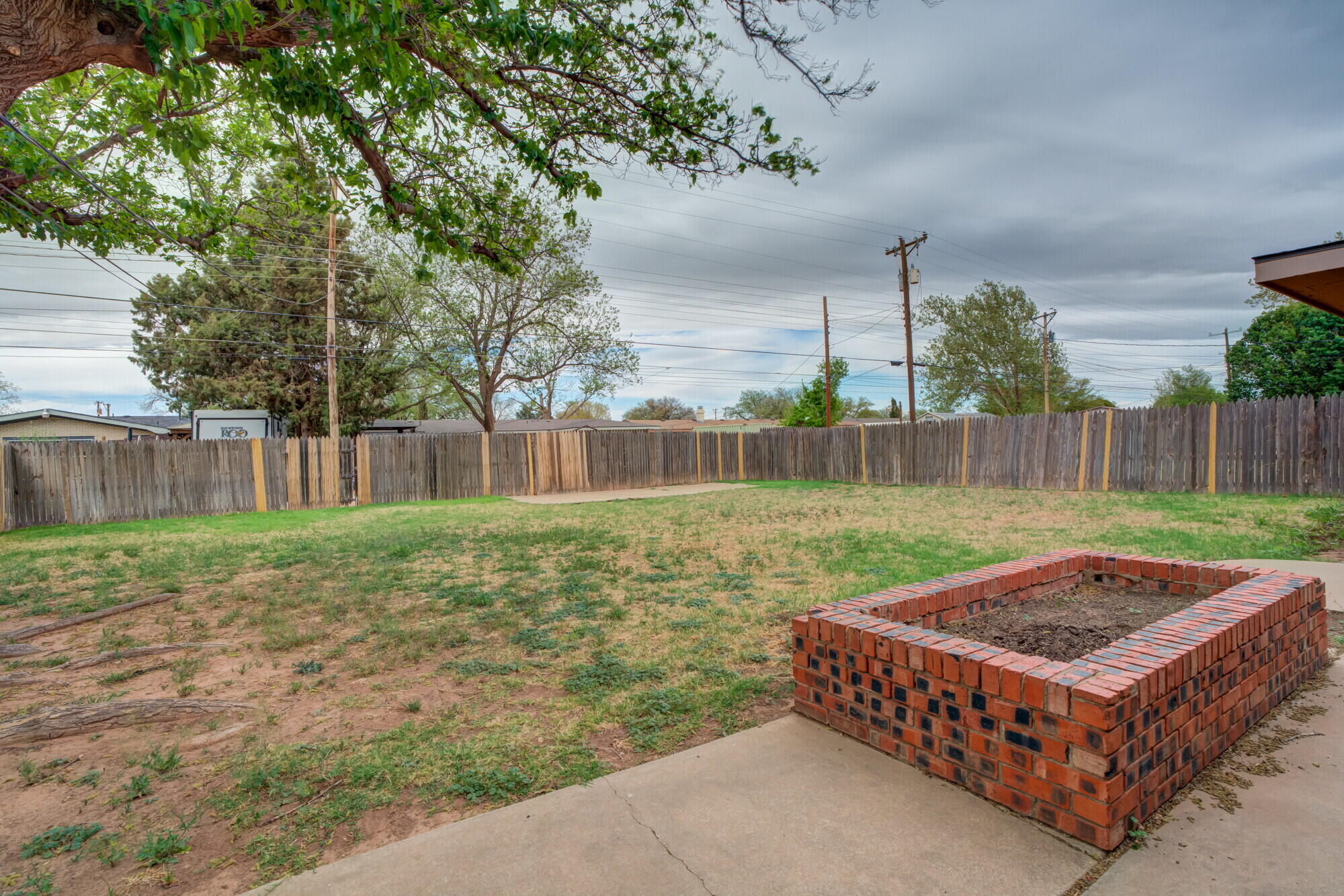 4916 46th Street Lubbock, TX 79414 - Photo 29 of 31 a backyard of a house with table and chairs
