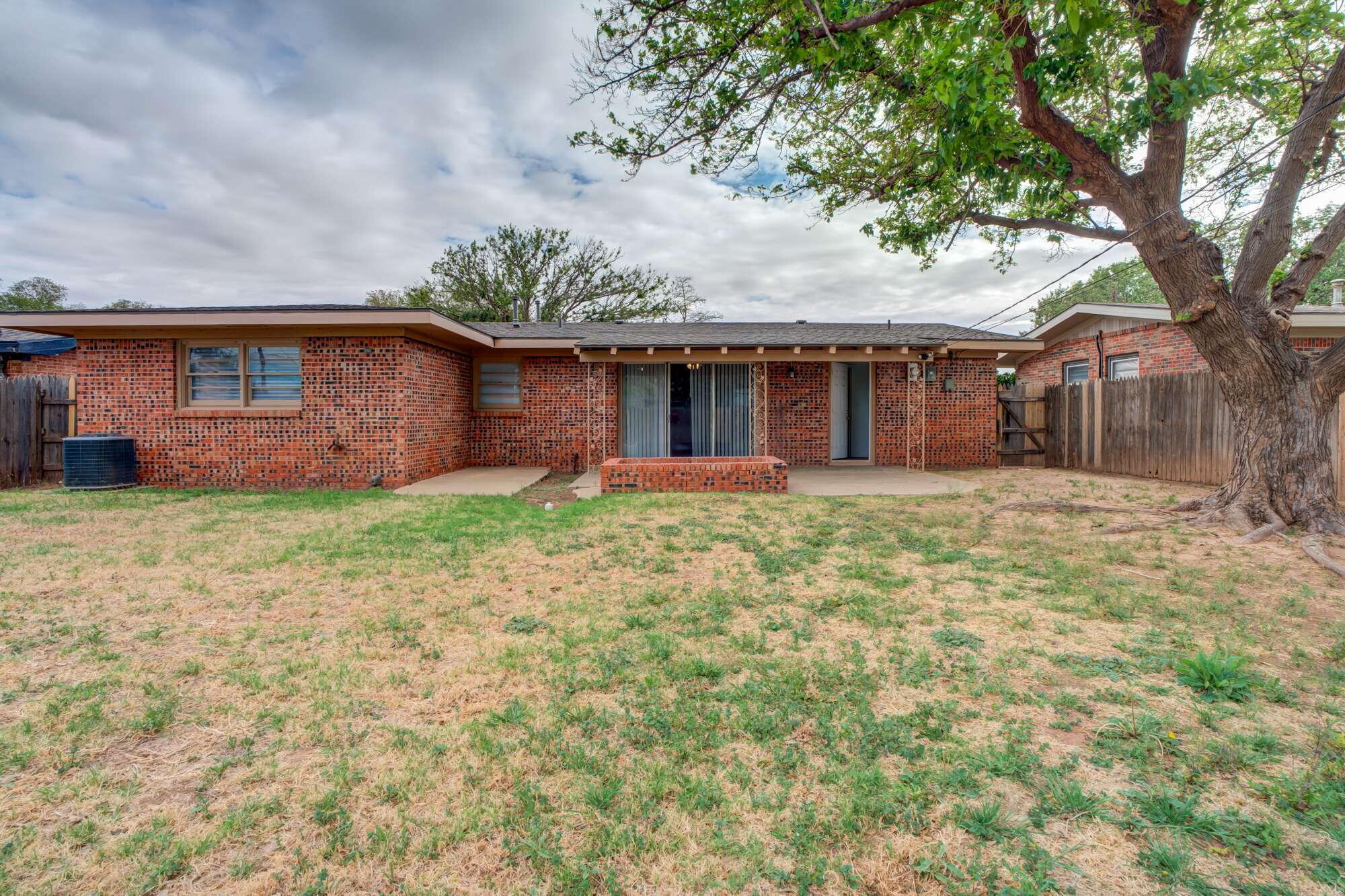 4916 46th Street Lubbock, TX 79414 - Photo 30 of 31 front view of a house with a yard