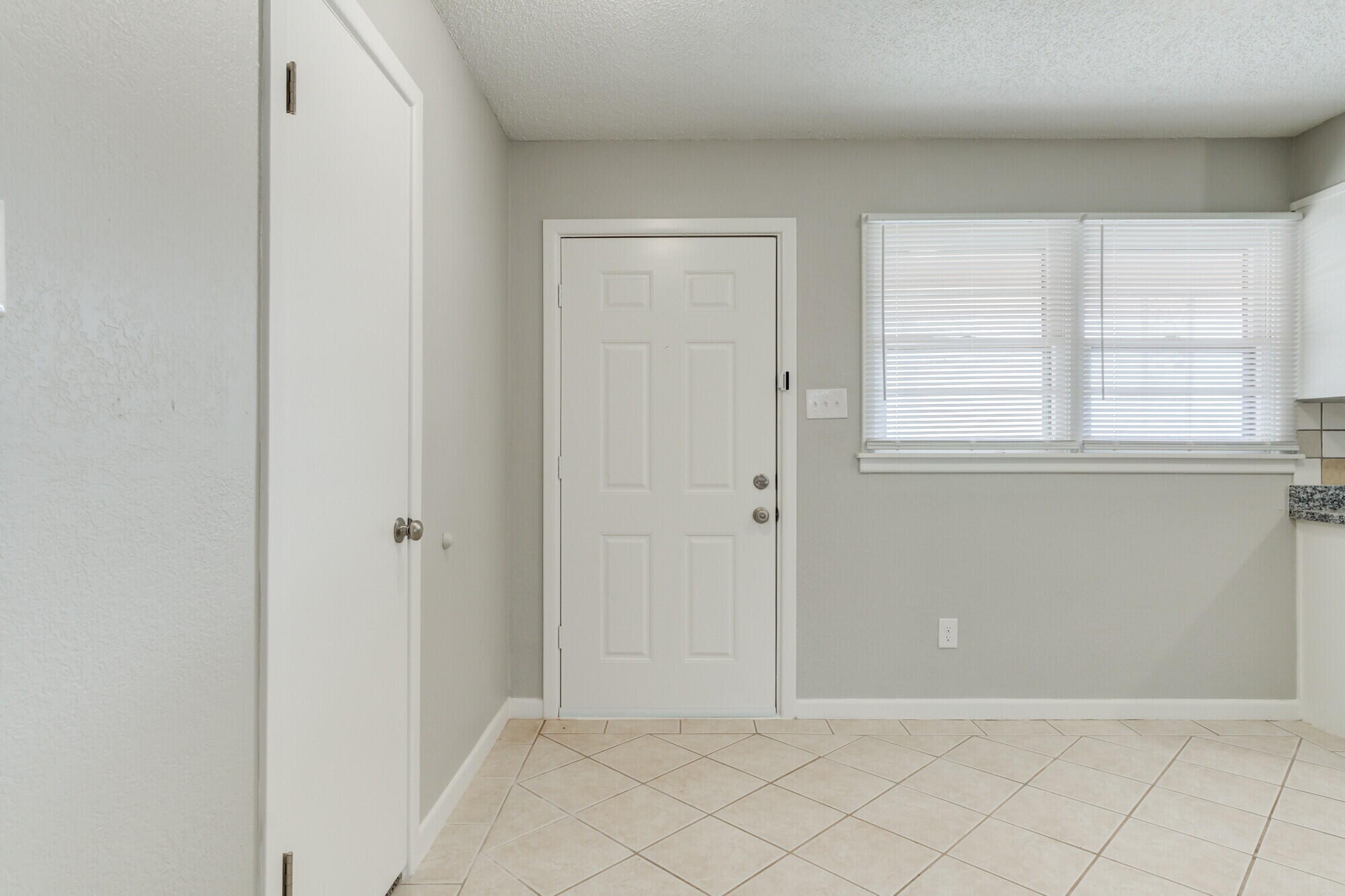 4916 46th Street Lubbock, TX 79414 - Photo 3 of 31 an empty room with windows