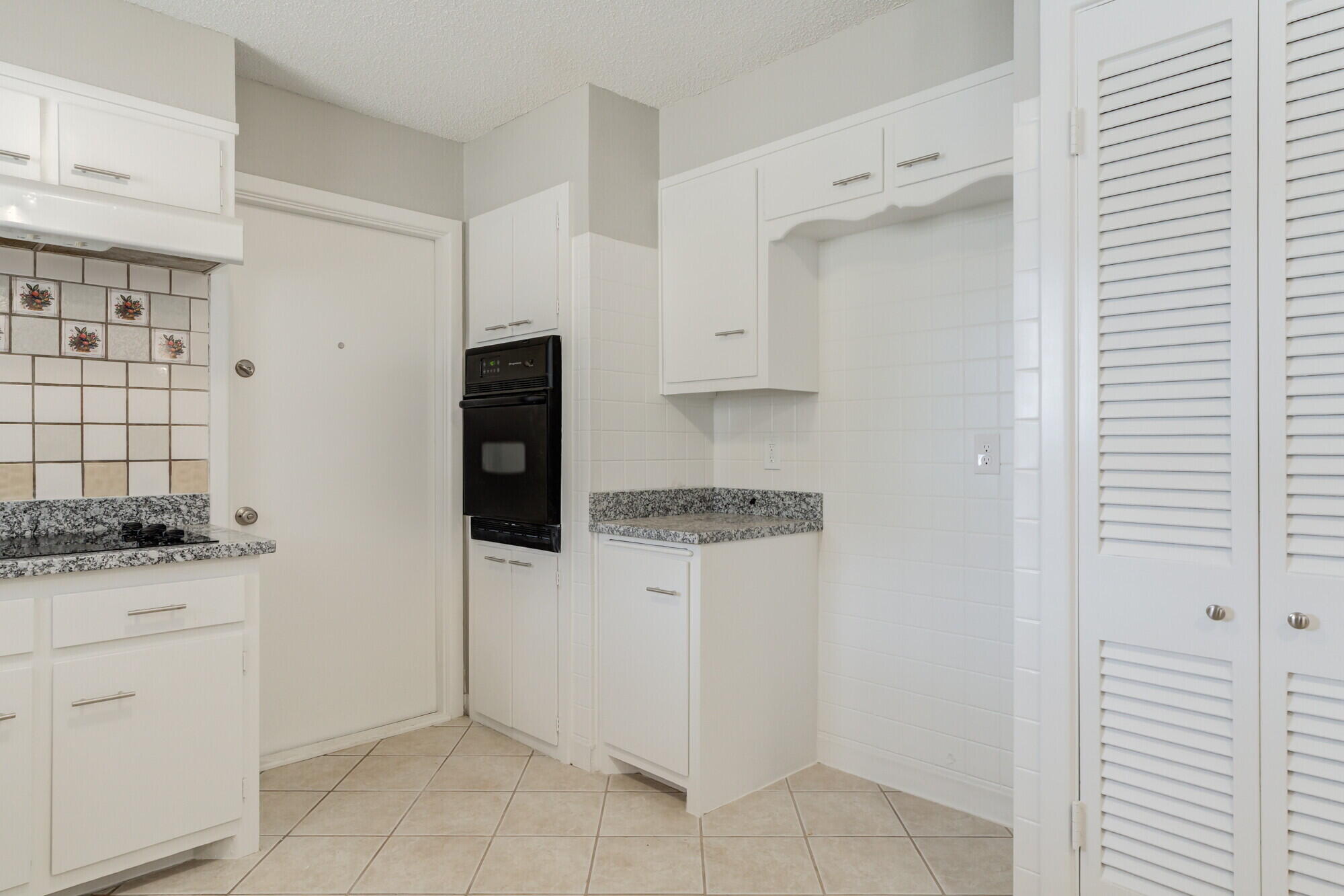 4916 46th Street Lubbock, TX 79414 - Photo 6 of 31 a kitchen with a stove and a refrigerator