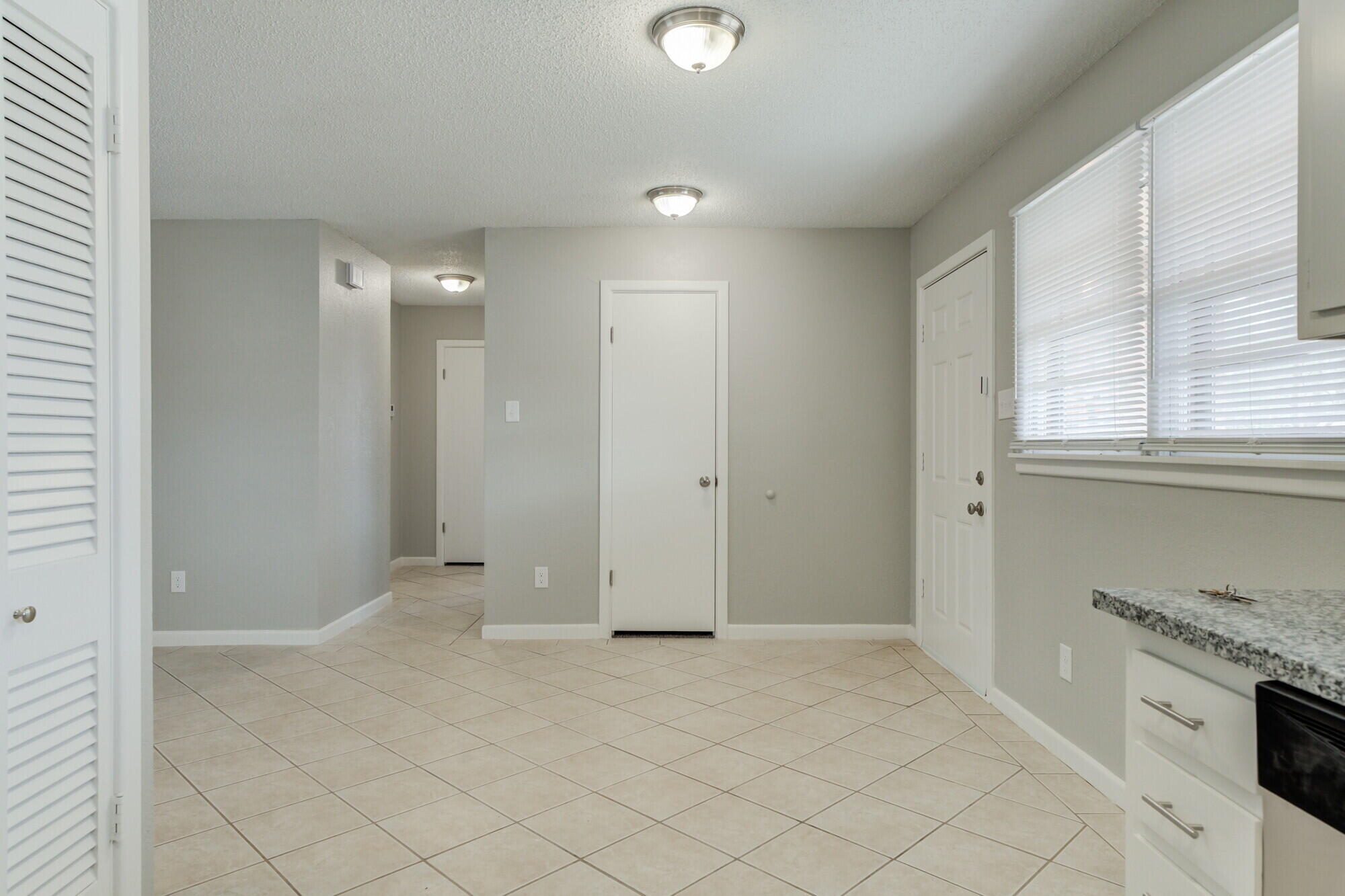 4916 46th Street Lubbock, TX 79414 - Photo 9 of 31 an empty room with windows