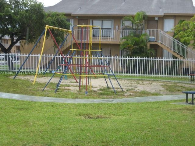 15328 Southwest 72nd Street, Unit 814 Miami, FL 33193 - Photo 13 of 15 a view of a house with a backyard
