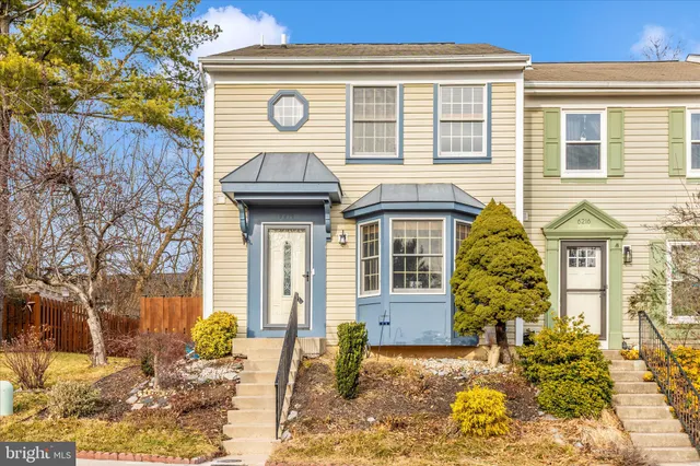 a view of a house with a small yard