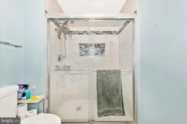 a bathroom with a toilet and shower