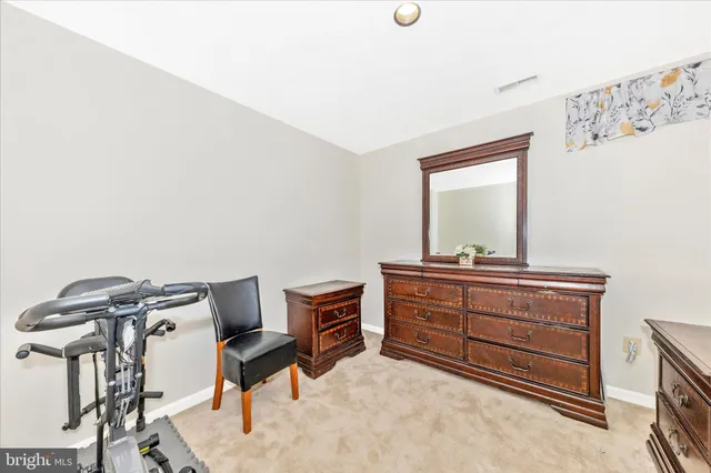 a room with a bed and a mirror