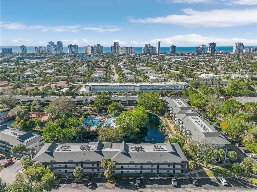 600 Neapolitan Way, Unit 349 Naples, FL 34103 - Photo 28 of 34 an aerial view of a city with lots of residential buildings
