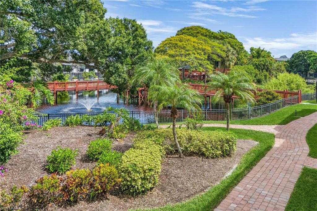 600 Neapolitan Way, Unit 349 Naples, FL 34103 - Photo 31 of 34 a backyard of a house with lots of green space