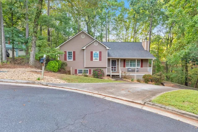 a front view of a house with garden
