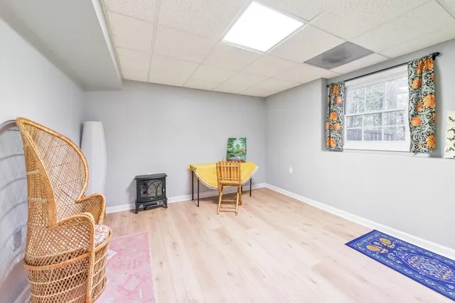 a view of a livingroom with furniture and a window