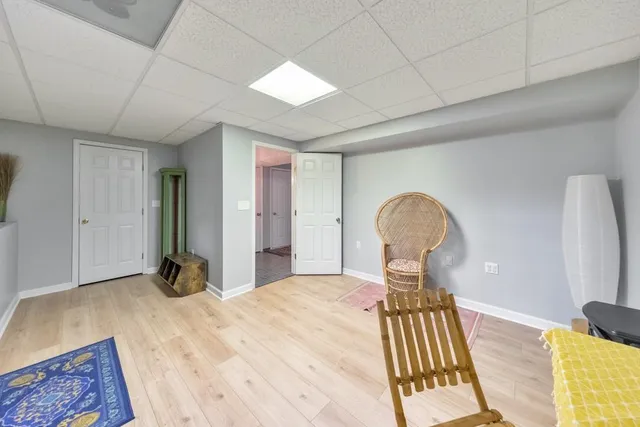 a view of balcony with wooden floor and outdoor seating