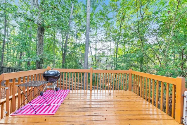 a view of a wooden deck with a patio