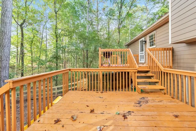 a view of a backyard with trees