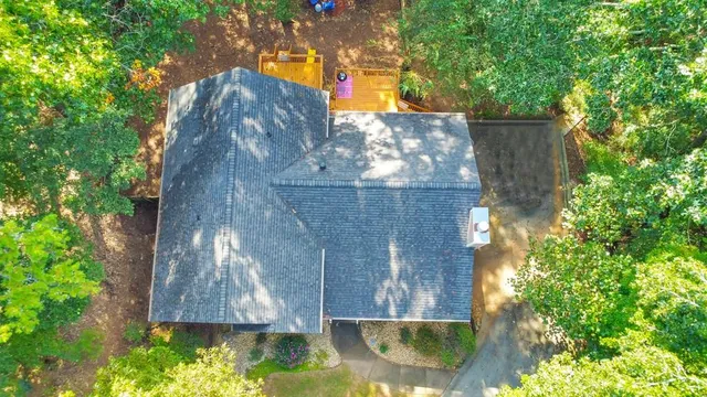 a view of house with a yard