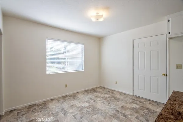 an empty room with closet area