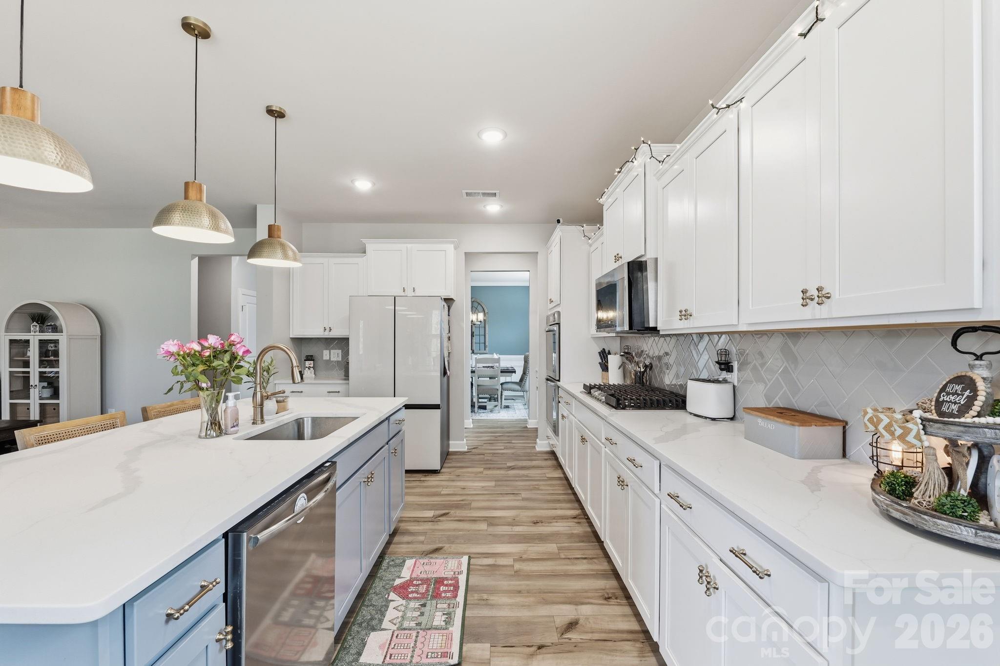 3911 Horsham Street Fort Mill, SC 29707 - Photo 14 of 41 a large white kitchen with lots of counter space and stainless steel appliances