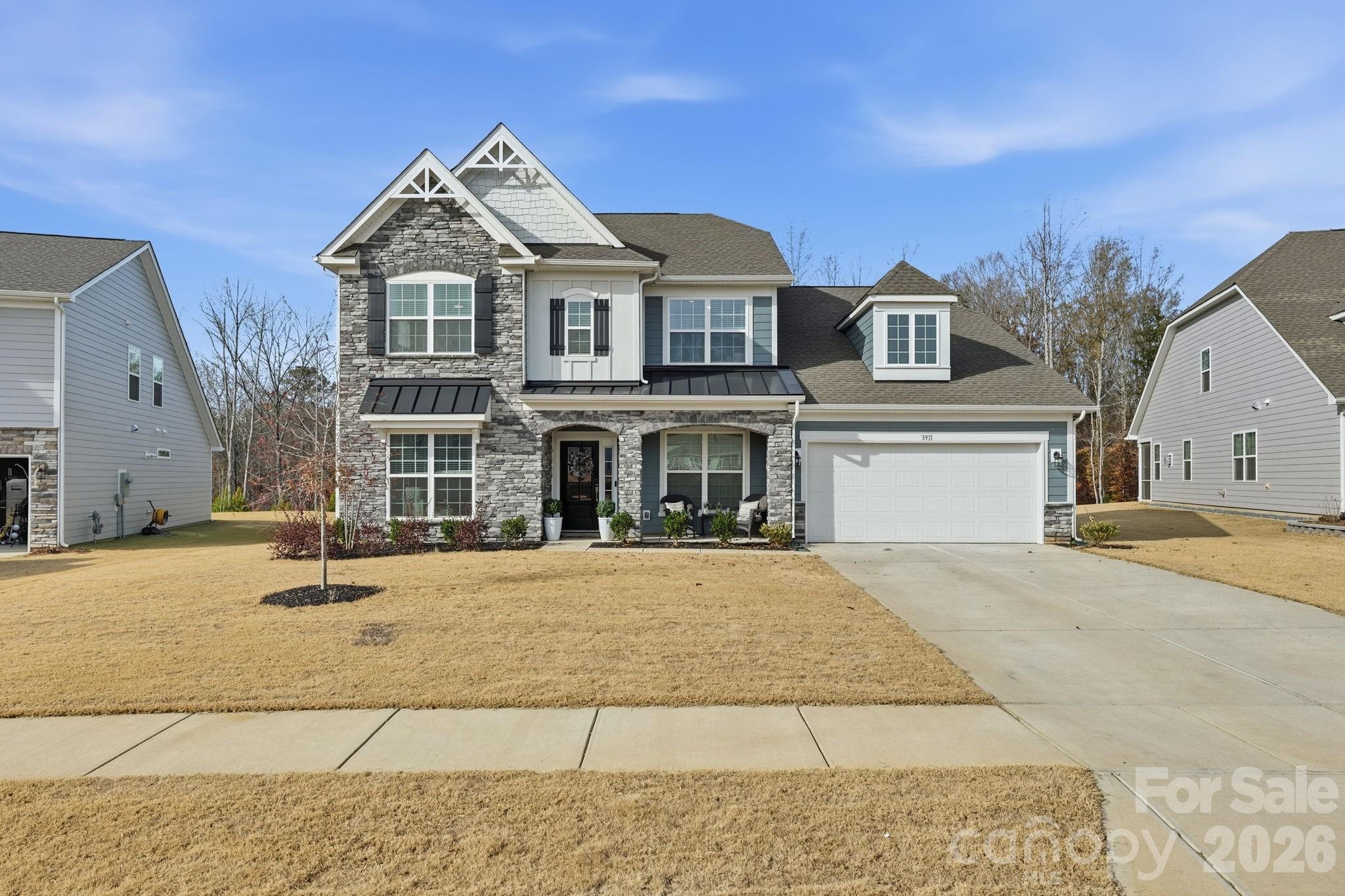 3911 Horsham Street Fort Mill, SC 29707 - Photo 2 of 41 a front view of a house with a yard