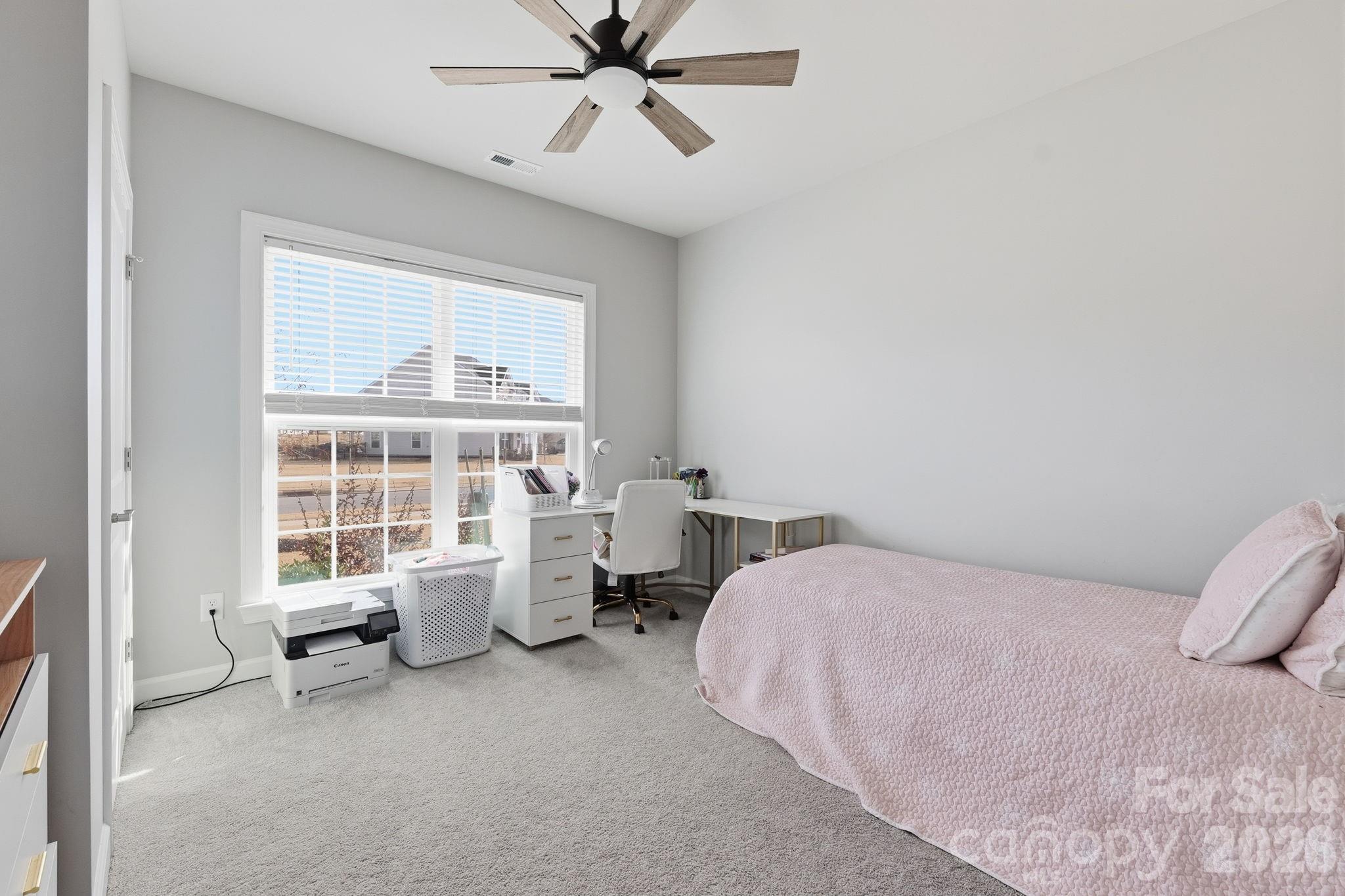 3911 Horsham Street Fort Mill, SC 29707 - Photo 21 of 41 a bedroom with a bed and wooden floor