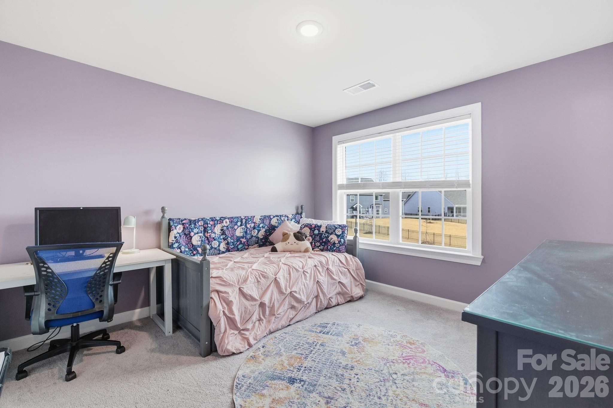 3911 Horsham Street Fort Mill, SC 29707 - Photo 25 of 41 a bedroom with a bed and large windows