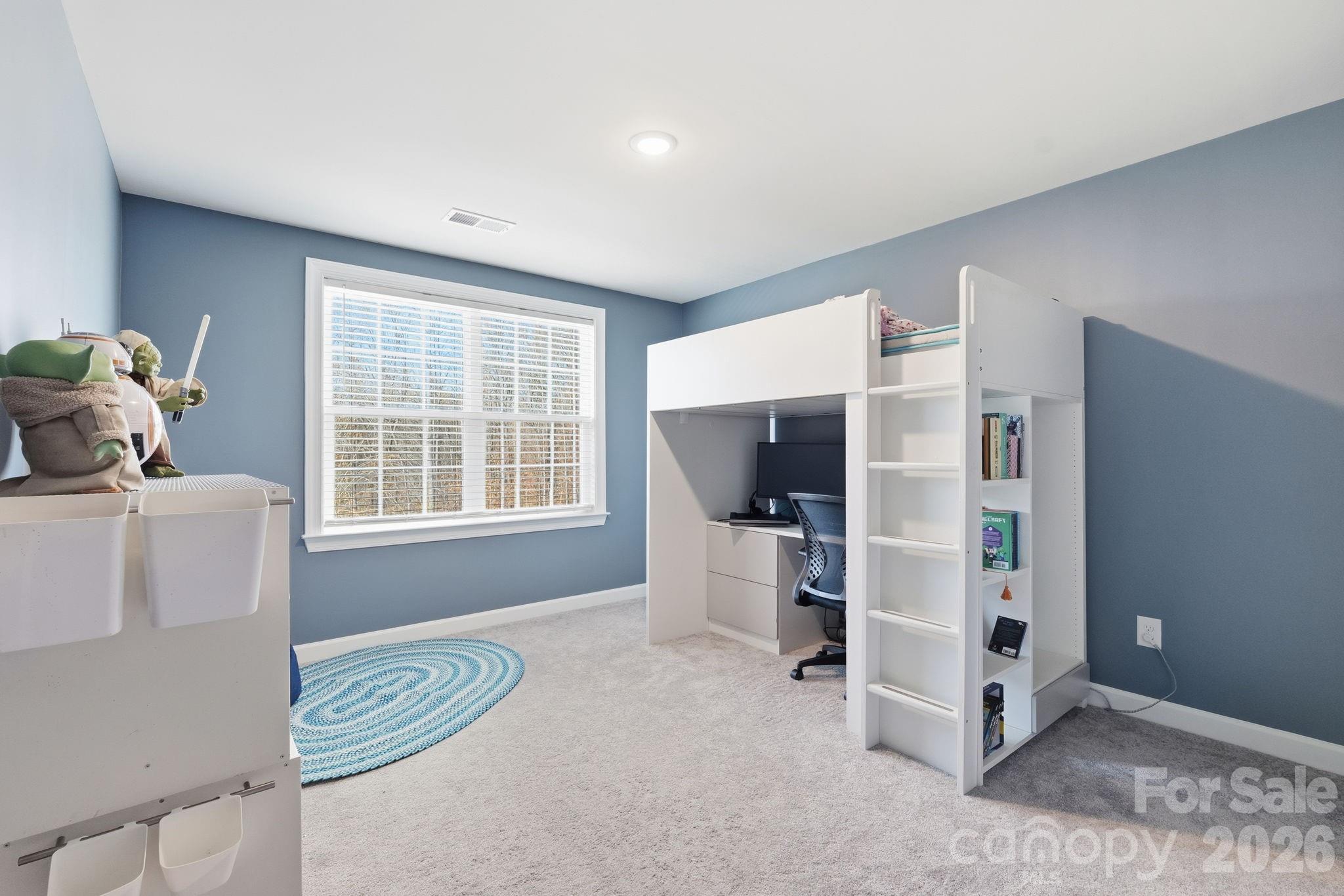 3911 Horsham Street Fort Mill, SC 29707 - Photo 26 of 41 a bedroom with furniture and a window