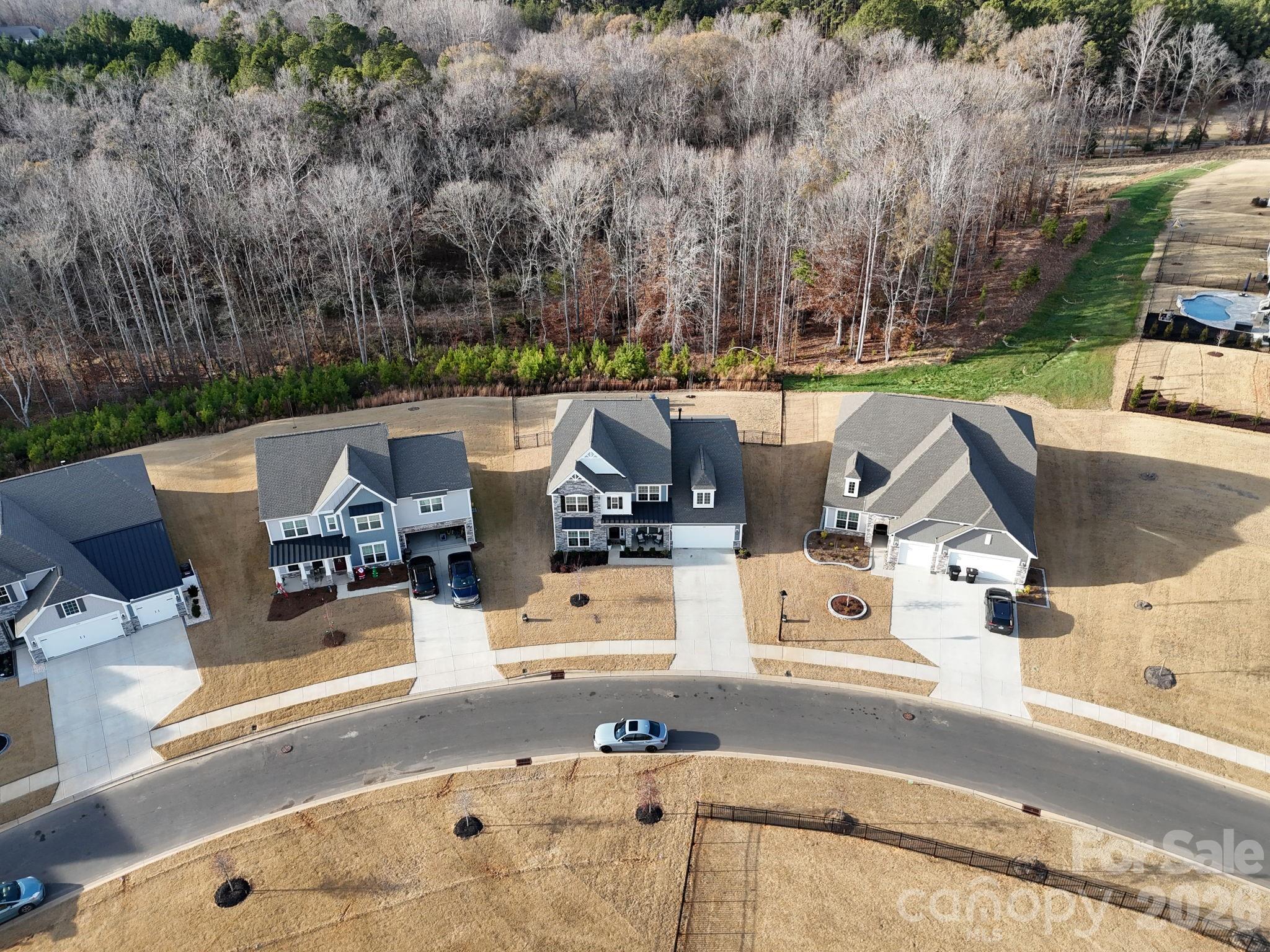 3911 Horsham Street Fort Mill, SC 29707 - Photo 39 of 41 an aerial view of a house with garden space and lake view