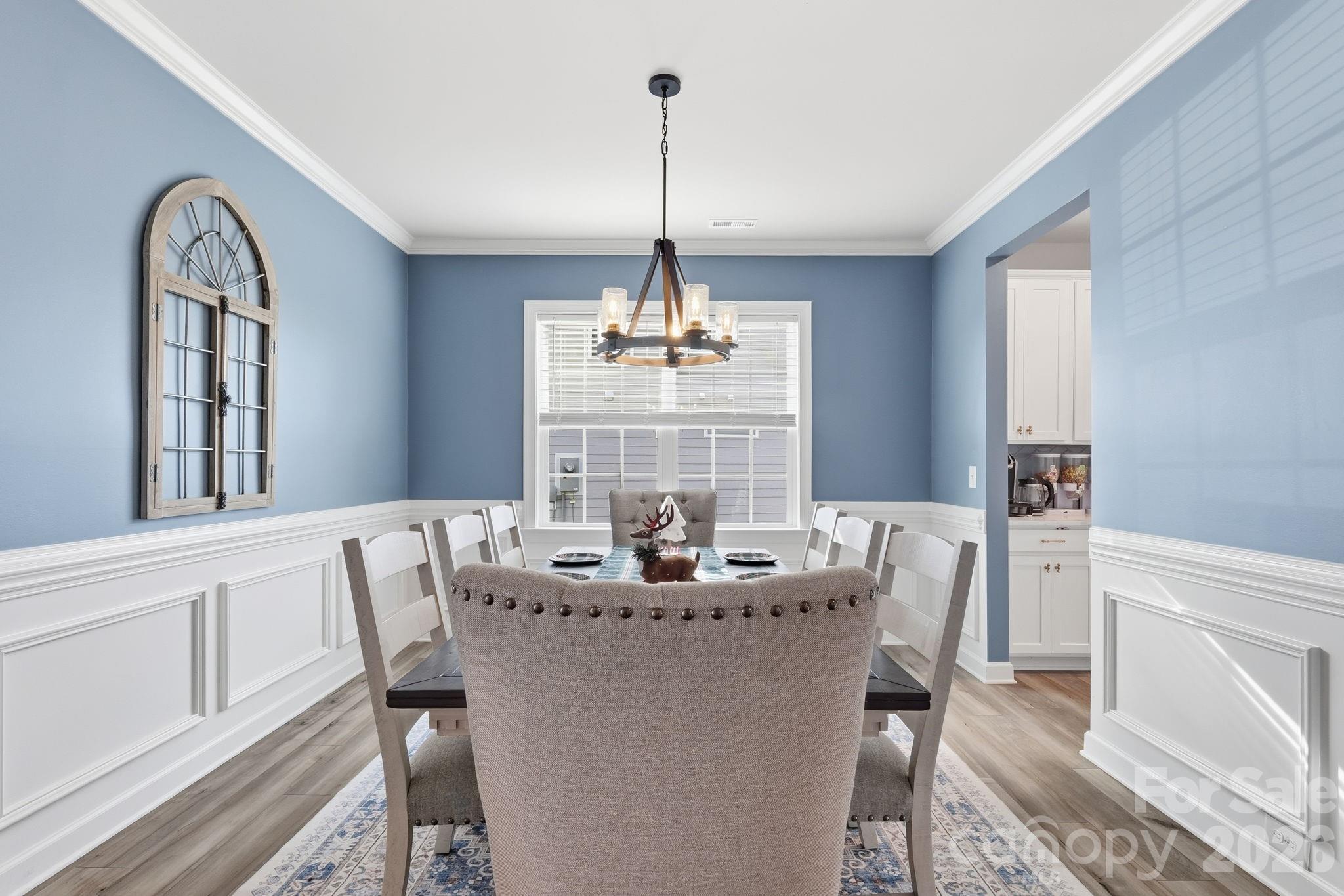 3911 Horsham Street Fort Mill, SC 29707 - Photo 6 of 41 a dining room with furniture a chandelier and window