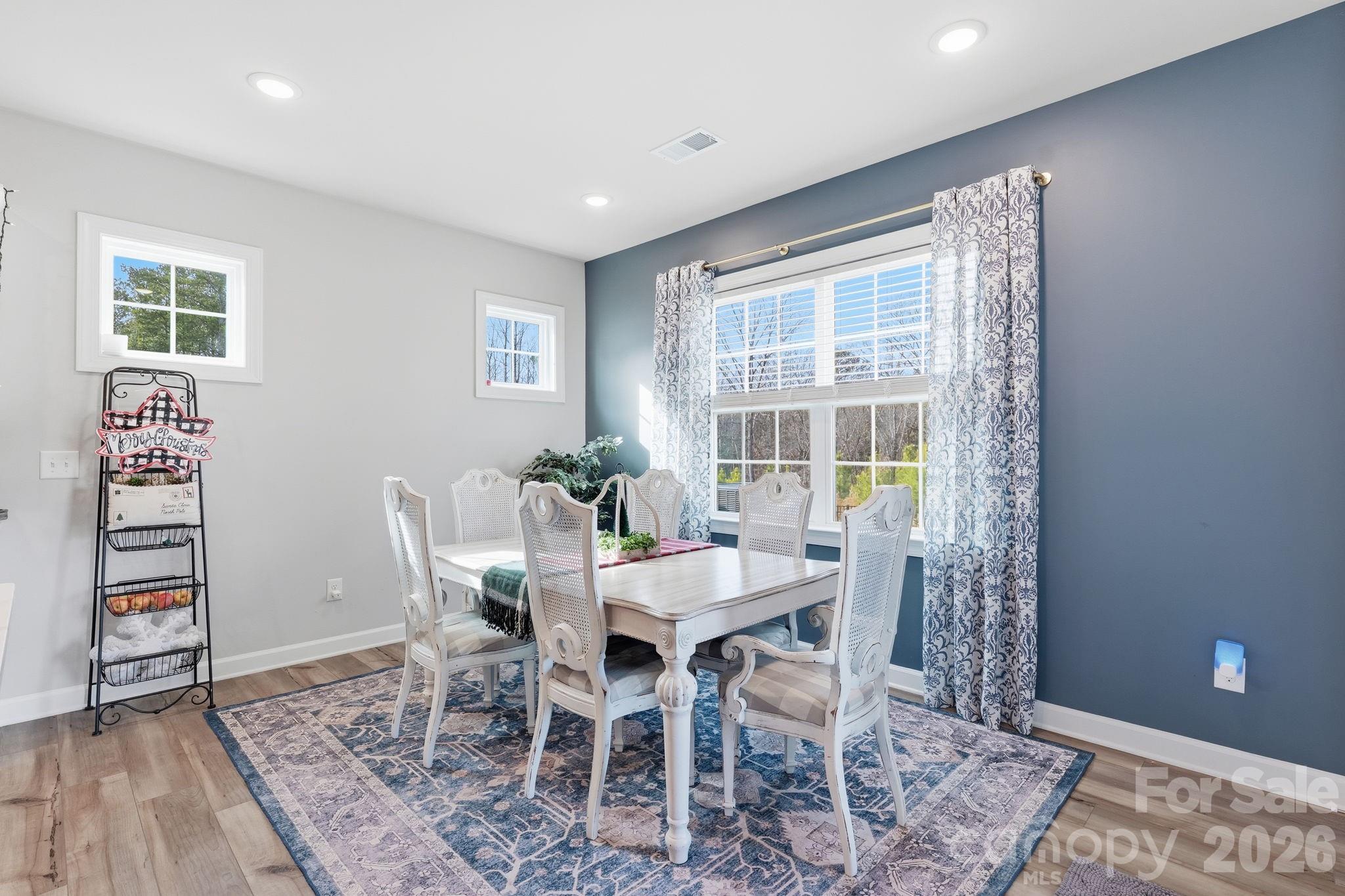 3911 Horsham Street Fort Mill, SC 29707 - Photo 8 of 41 a view of a dining room with furniture window and wooden floor