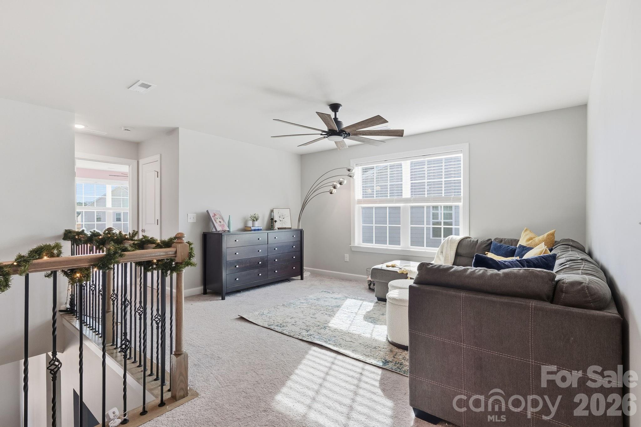 3911 Horsham Street Fort Mill, SC 29707 - Photo 10 of 41 a living room with furniture a window and a chandelier