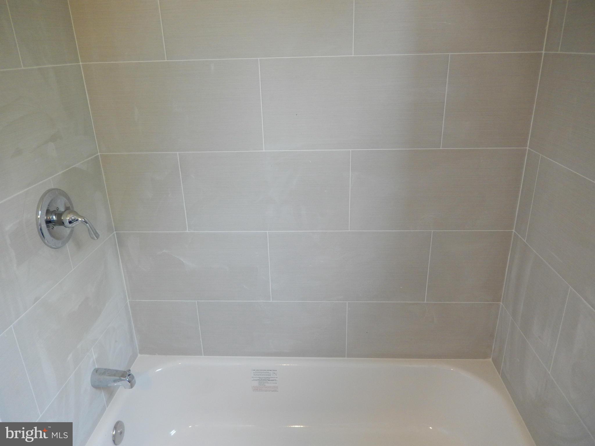 4301 Cedar Garden Road Baltimore, MD 21229 - Photo 13 of 29 a close up view of a bathtub