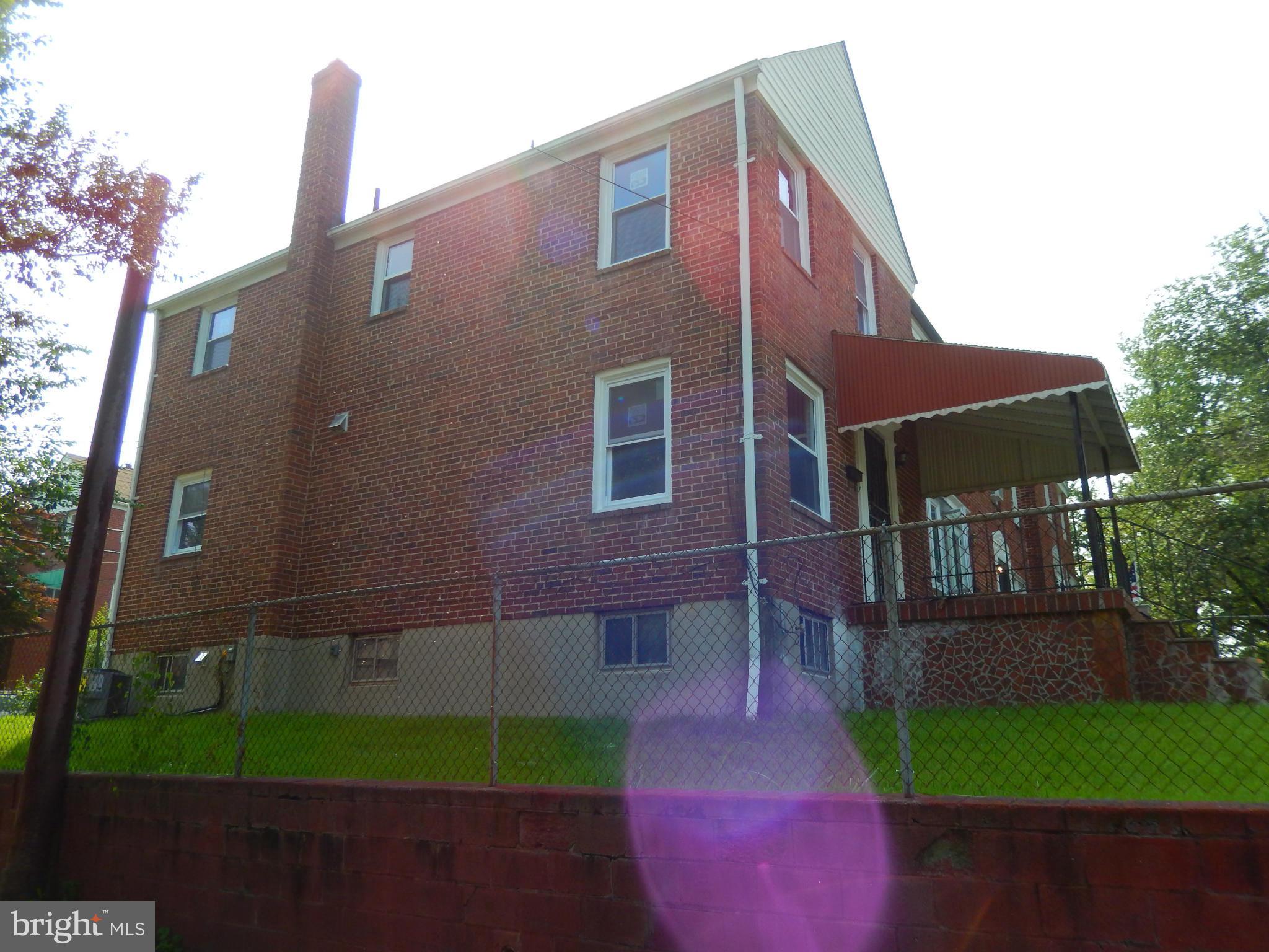 4301 Cedar Garden Road Baltimore, MD 21229 - Photo 3 of 29 a front view of a house with garden
