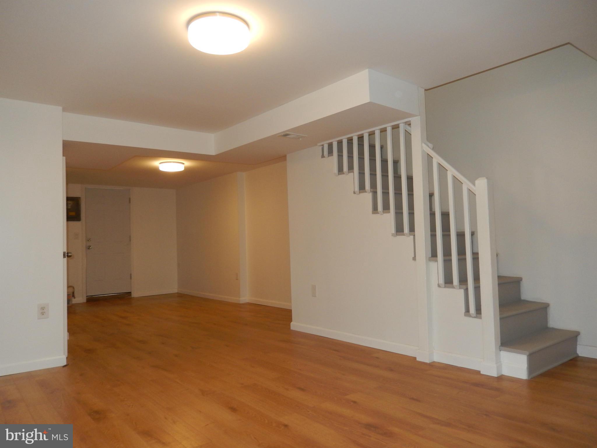 4301 Cedar Garden Road Baltimore, MD 21229 - Photo 24 of 29 a view of an entryway with wooden floor