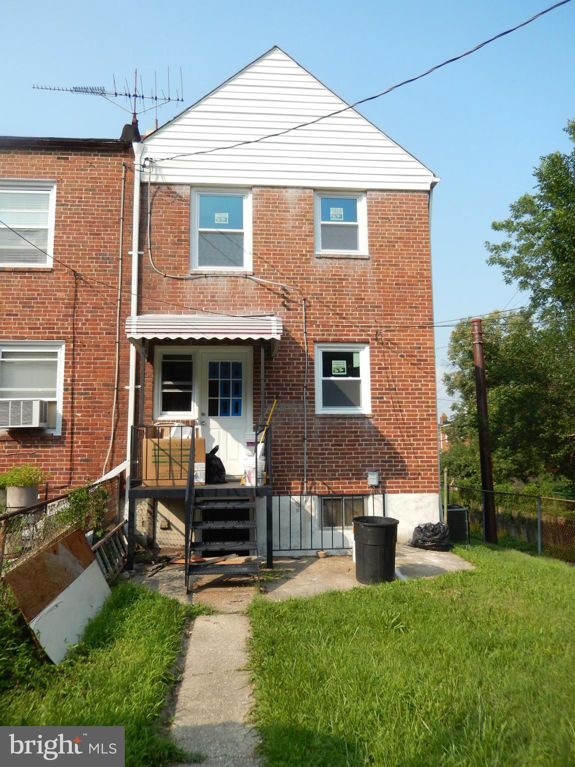 4301 Cedar Garden Road Baltimore, MD 21229 - Photo 4 of 29 a front view of a house with garden