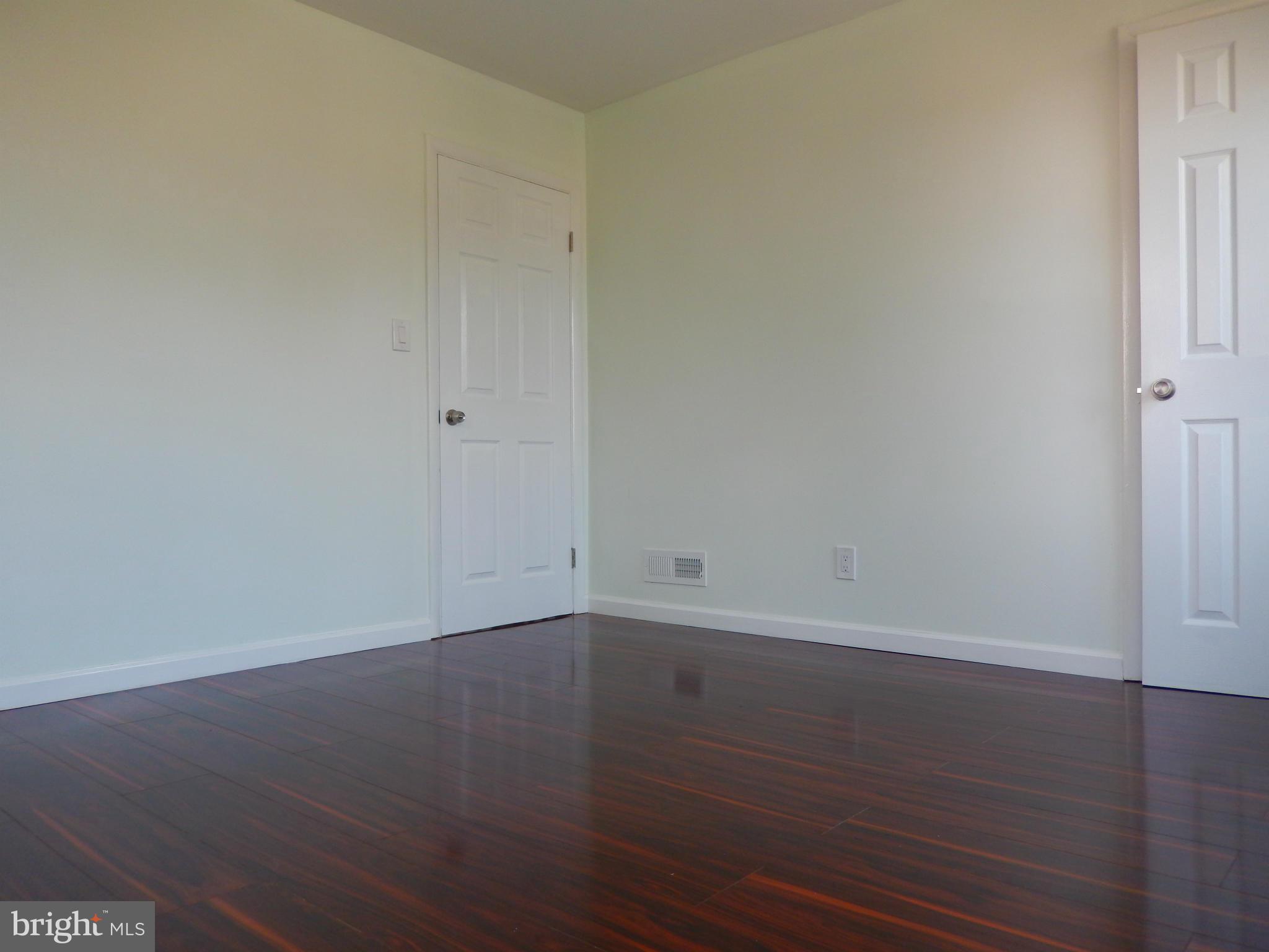 4301 Cedar Garden Road Baltimore, MD 21229 - Photo 7 of 29 a view of a room that has wooden floor in it