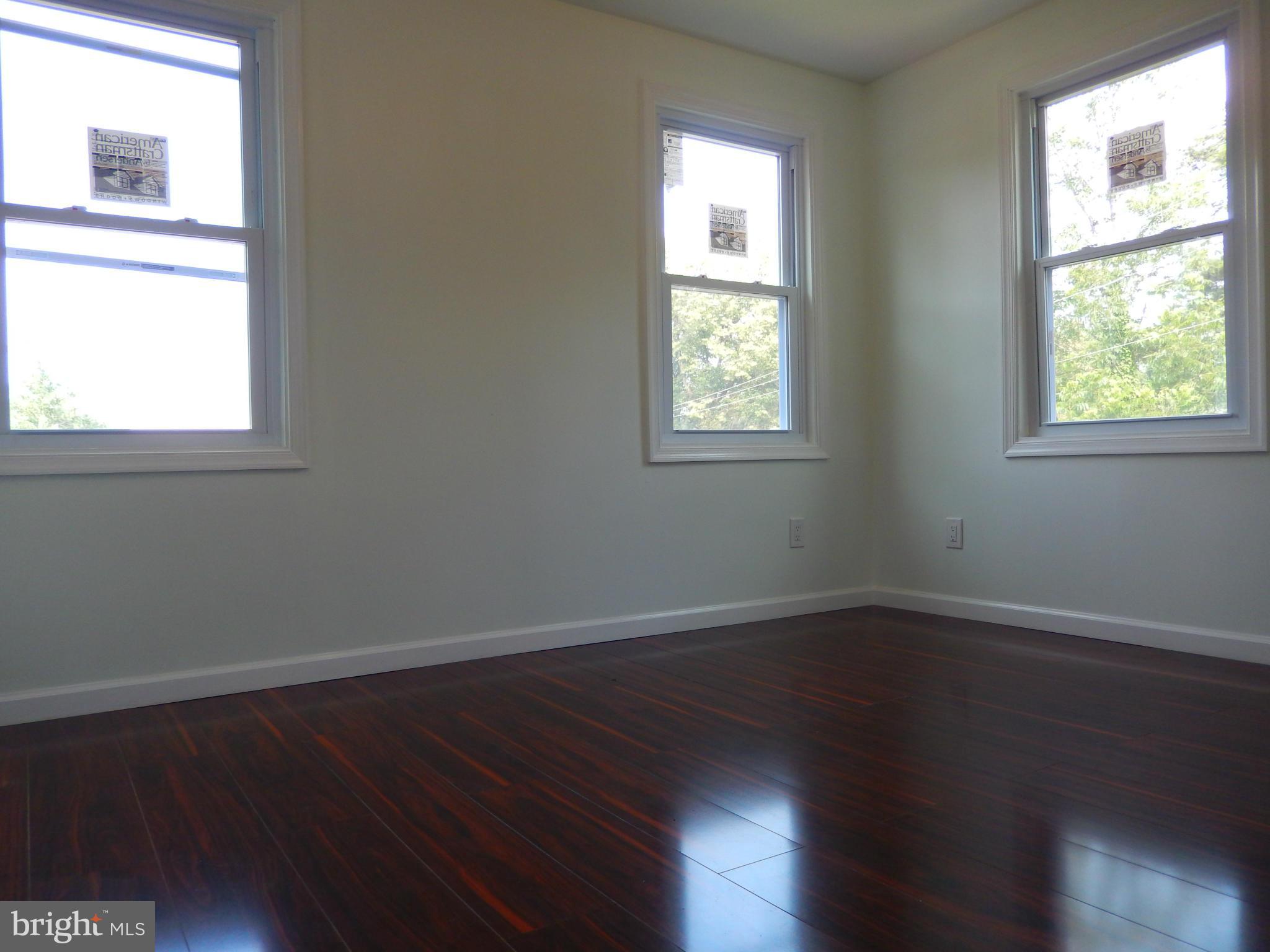 4301 Cedar Garden Road Baltimore, MD 21229 - Photo 8 of 29 an empty room that has a window