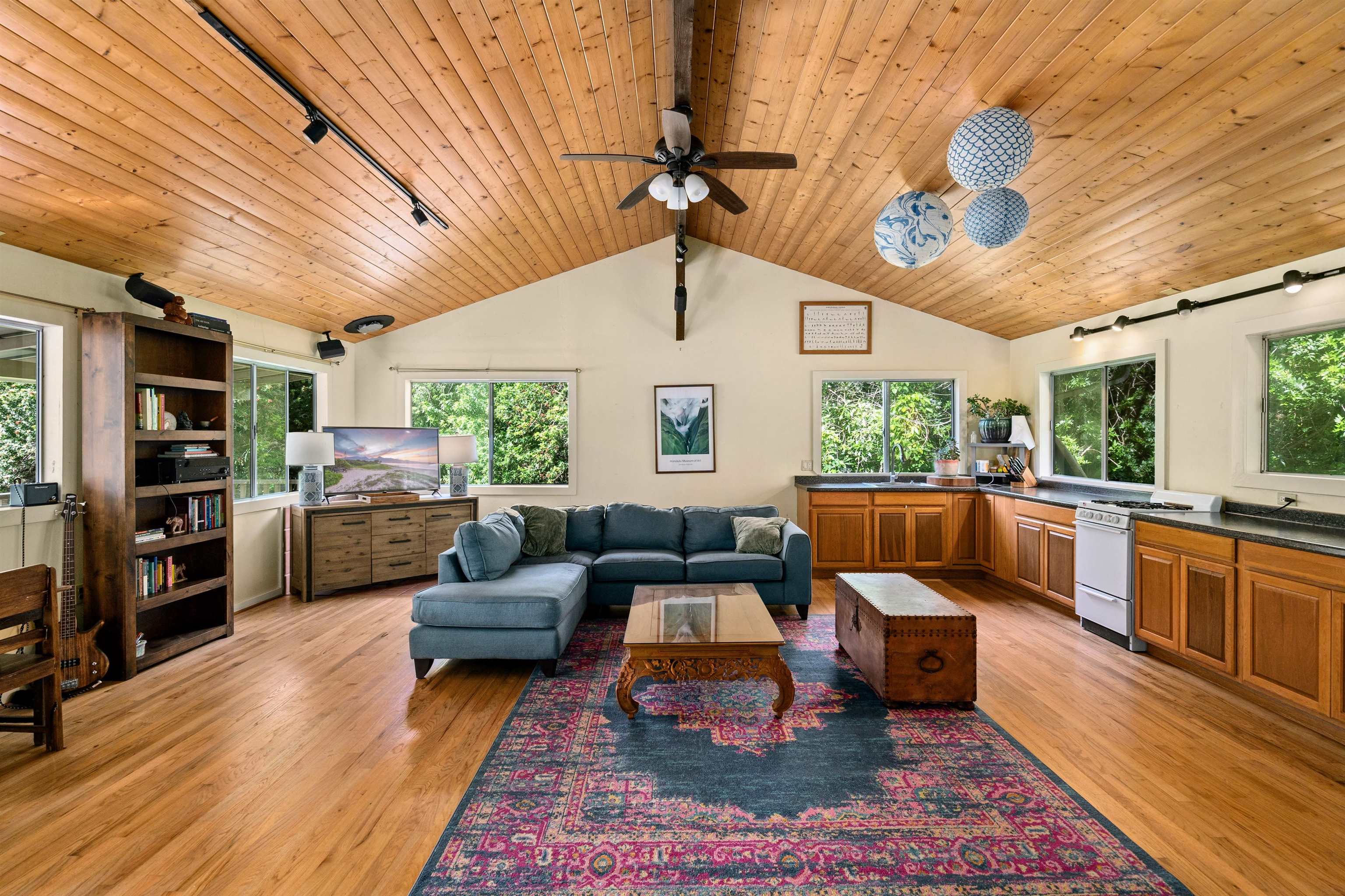 1870 West Kuiaha Road Haiku, HI 96708 - Photo 1 of 27 a living room with furniture large window and wooden floor
