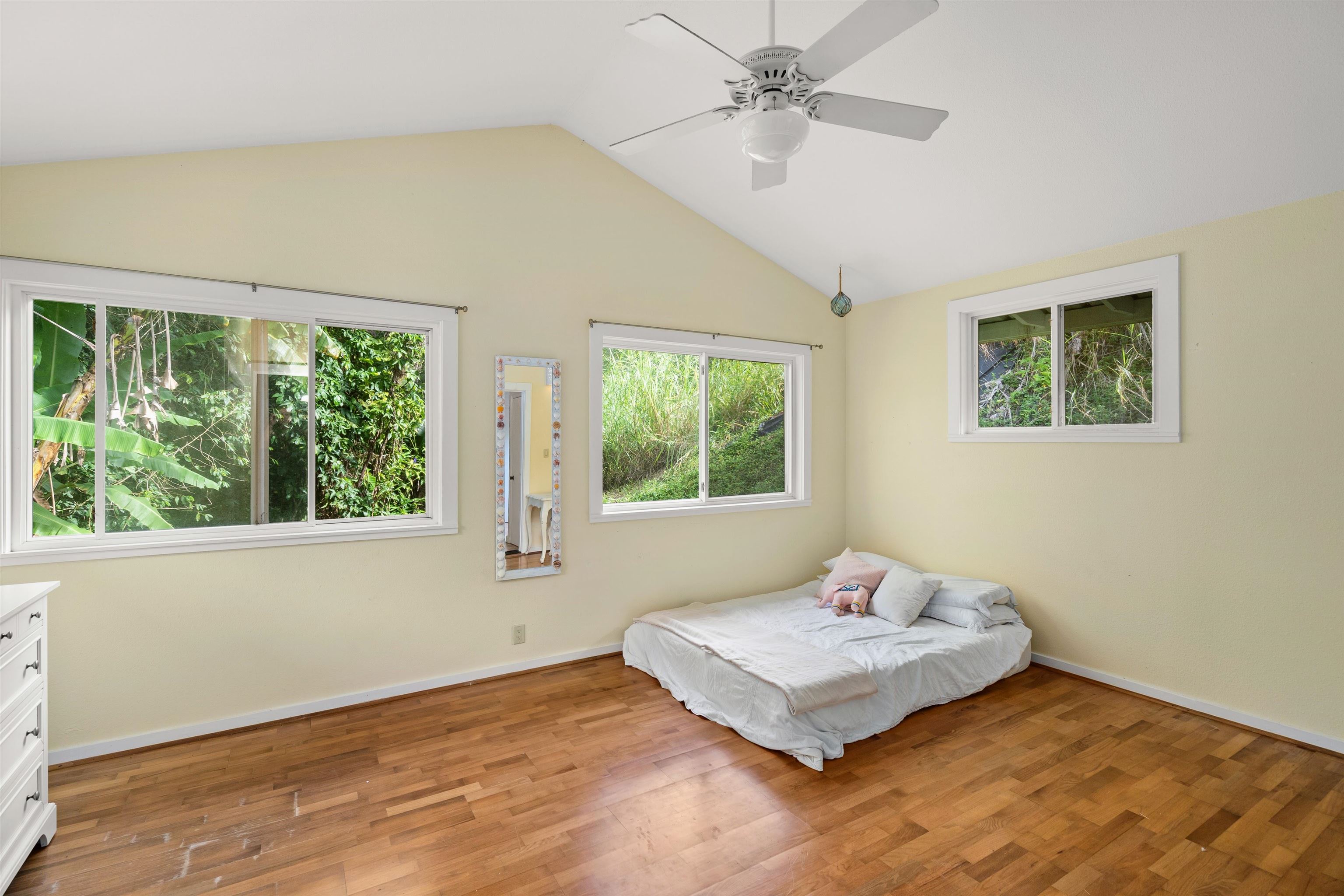 1870 West Kuiaha Road Haiku, HI 96708 - Photo 11 of 27 a bedroom with a bed and a window