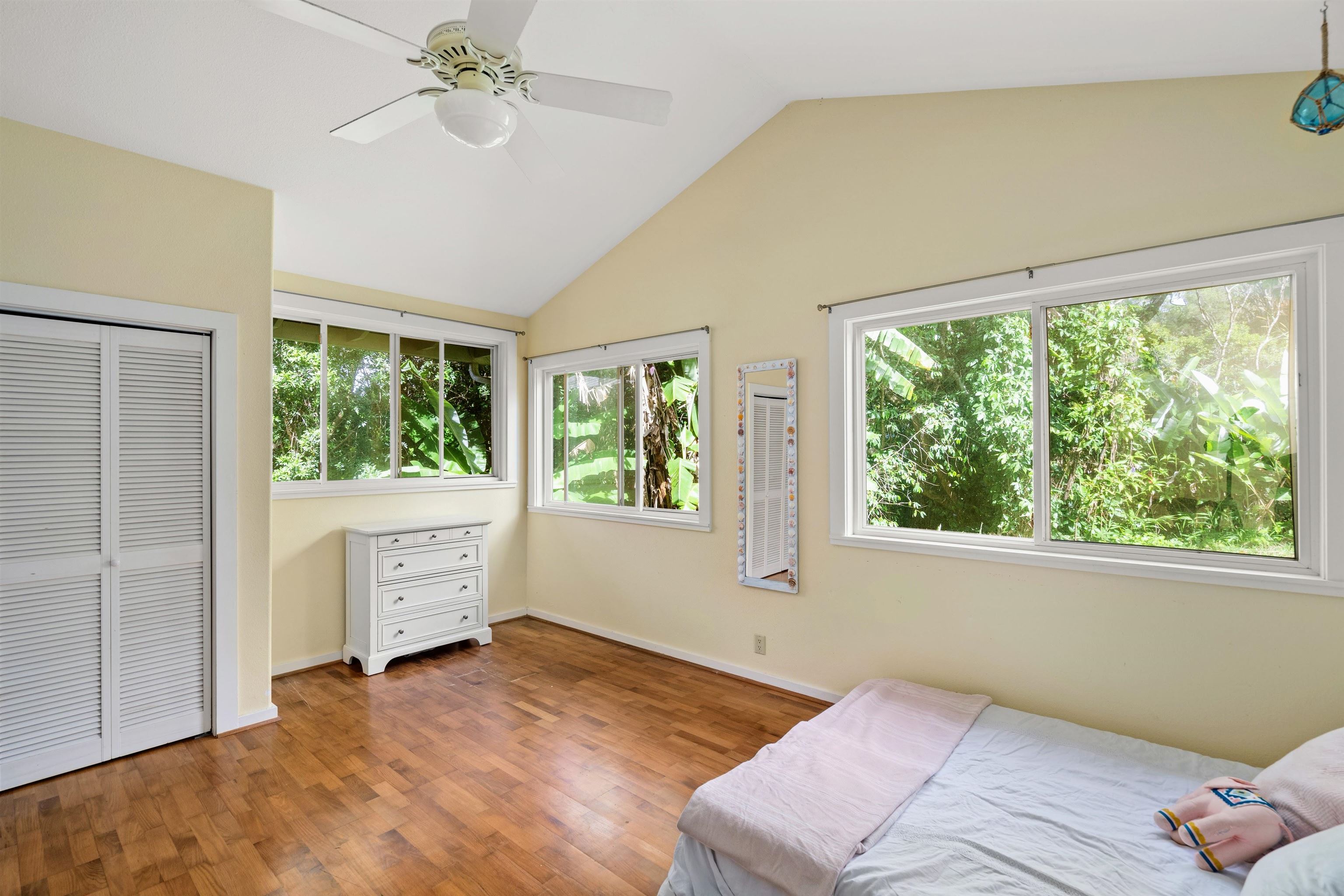 1870 West Kuiaha Road Haiku, HI 96708 - Photo 12 of 27 a bedroom with a bed and a window
