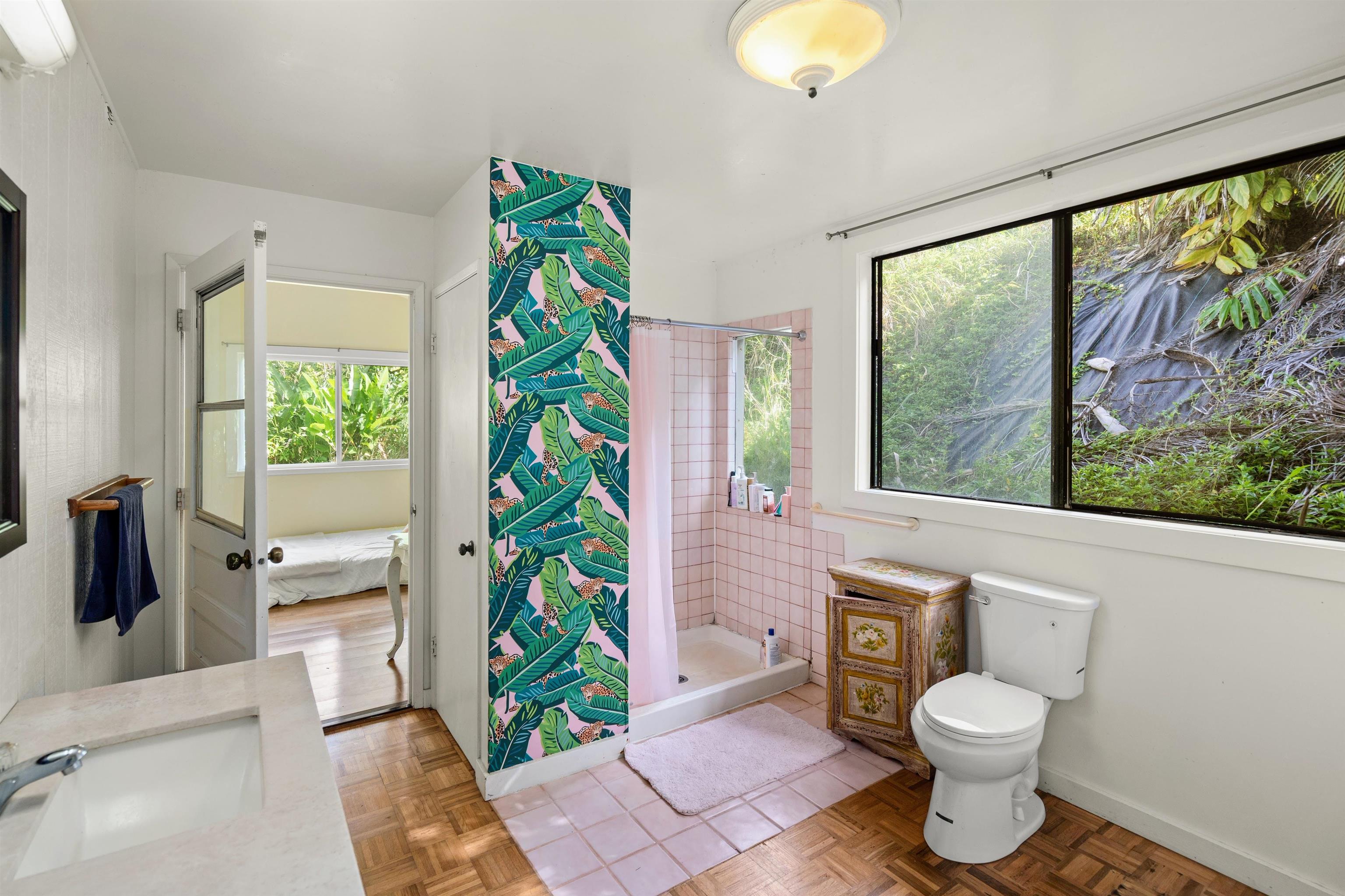 1870 West Kuiaha Road Haiku, HI 96708 - Photo 13 of 27 a bathroom with a toilet a sink and a large mirror