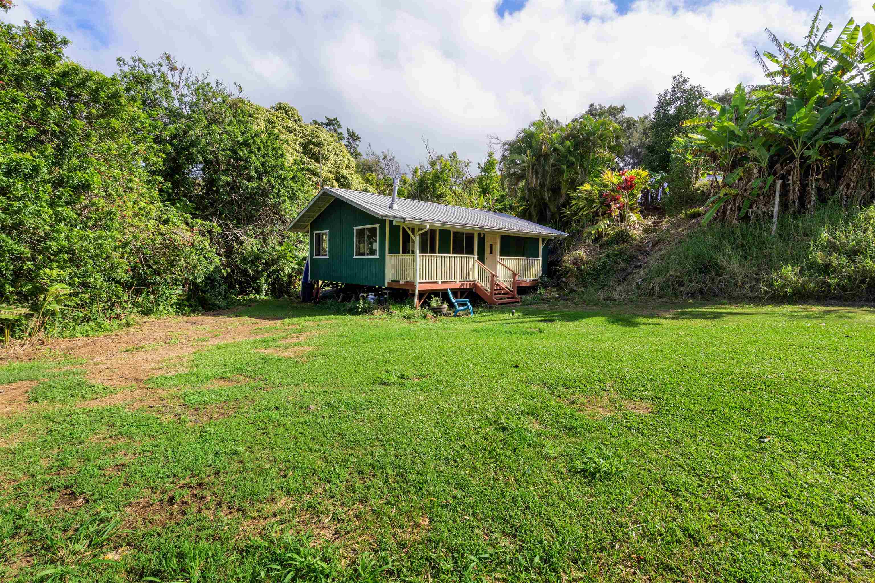 1870 West Kuiaha Road Haiku, HI 96708 - Photo 4 of 27 a view of a house with a big yard