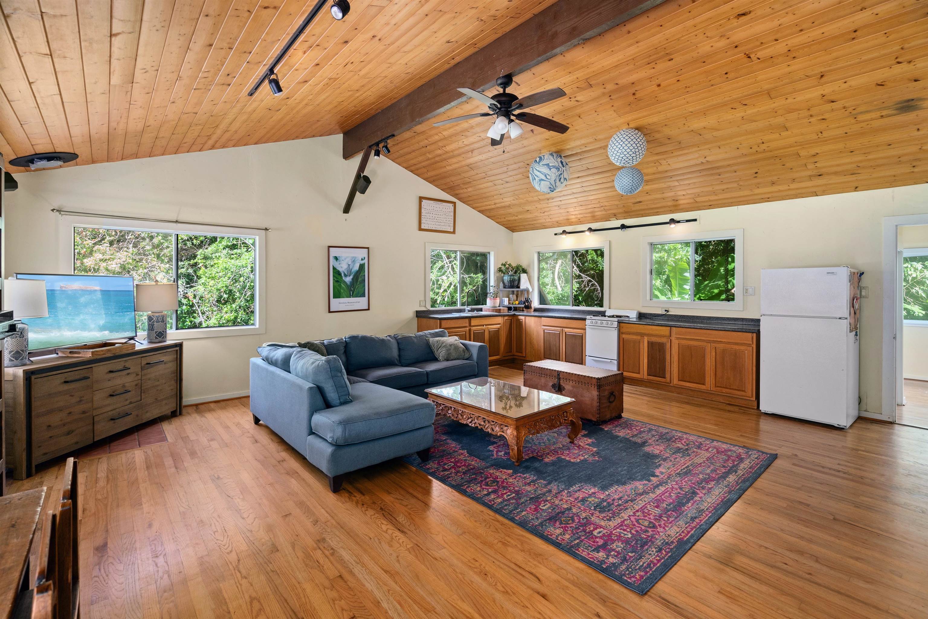 1870 West Kuiaha Road Haiku, HI 96708 - Photo 7 of 27 a living room with furniture and a fireplace