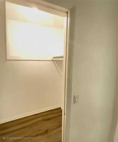 a view of wooden floor and brick walls