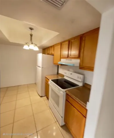 a kitchen that has a sink and a stove